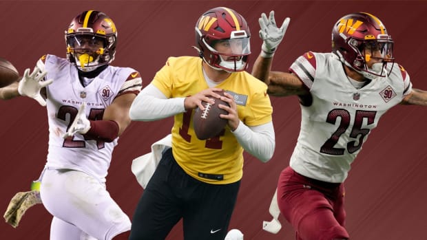 Washington Commanders quarterback Sam Howell (center), running back Antonio Gibson (left), and cornerback Benjamin St-Juste (right).